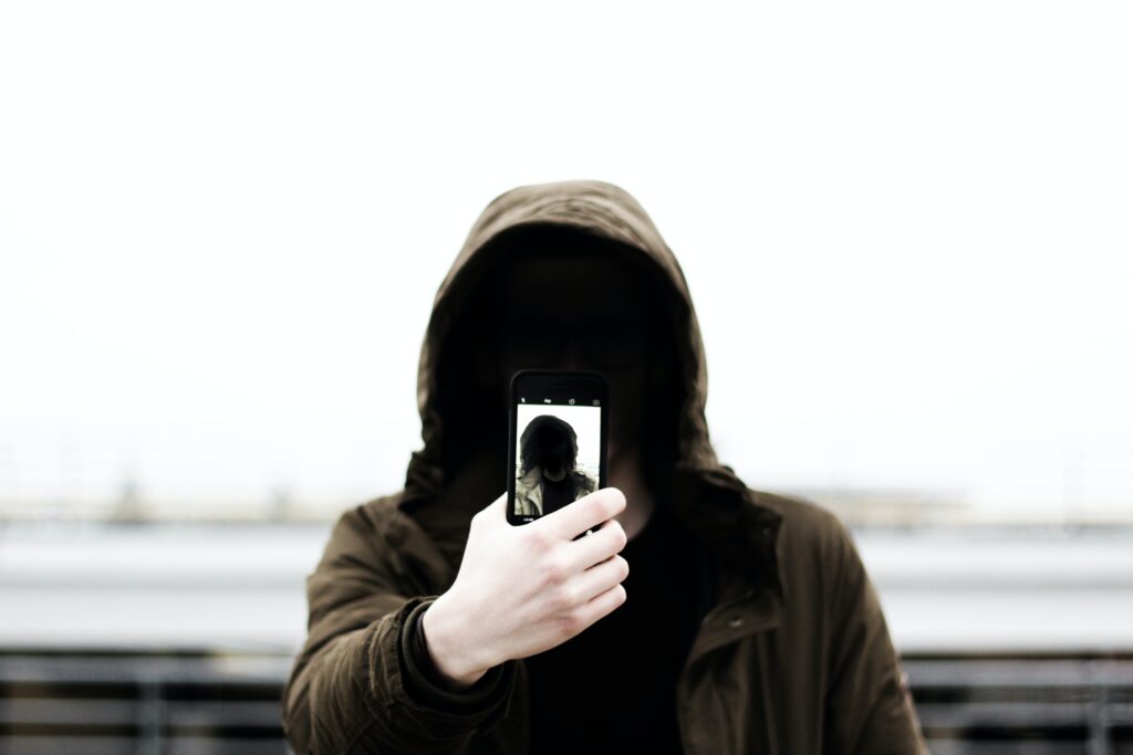 Hacker in the darkness ready to steal your data from Facebook